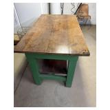 Heavy wooden work table in basement 4