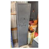 Grey metal cabinet with skull drawing