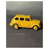 Cast-iron yellow taxi