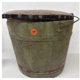 Old green painted bucket with leather top lid