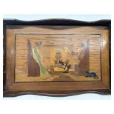 Hand carved wooden tray sitting by the f