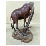 HAnd carve wooden giraffe