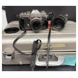 Nikon 35 mm camera with photo in original case