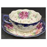 Blue flower, tea, cup, and saucer