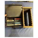 Cassettes and rack Billy Joel sticks George Benson