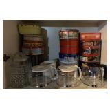 ITEMS FROM THE CABINET-COLLECTOR TINS & GLASS