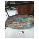 What Happens at the Cabin Metal Sign