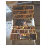 Tackle box full of fishing lures and misc. items