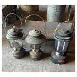 Three Coleman lanterns