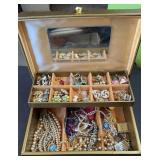 jewelry box full of jewelry, earrings, and neck