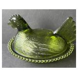 Green hen on the nest dish
