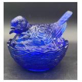 Cobalt blue bird on a nest Hazel Atlas