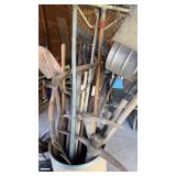 Card board barrel full of garden tools