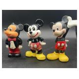 Three Mickey Mouse figurines
