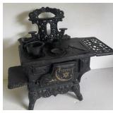 CRESENT CAST IRON STOVE AND ATTACHMENTS