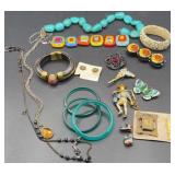 Assortment of necklaces, brooches, and bracelets