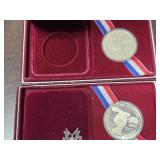 Pair of Olympic Silver Dollars