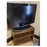 Large Television and Entertainment Stand