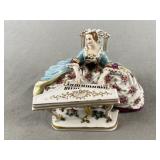 Lady Playing Piano Porcelain Figurine