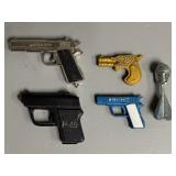 Four Assorted Miniature Pistols + Bomb
