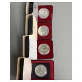 Four Canadian One Dollar Coins