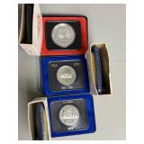 Three Canadian One Dollar Coins