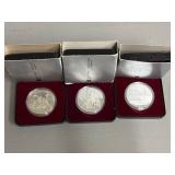 Three Canadian One Dollar Coins