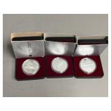 Three Canadian One Dollar Coins