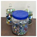 Assorted Glass Marbles in Jars