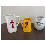 Three Small Advertising Pitchers