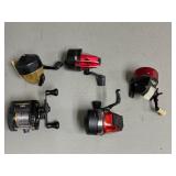 Four ABU Spincast Reels, One ABU Baitcast Reel