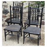 Four Black Ladder Backed Chairs