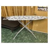 Ironing board with iron holder