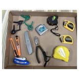 Tape measure, box cutters clamps
