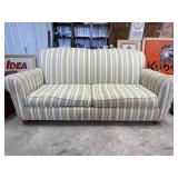 Striped upholstered sofa, olive green, cream. tan