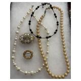 Vintage Pearl Necklaces feel real and brooches