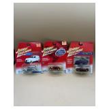 Three Johnny lightning collector cars