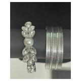 Silver tone cuff bracelets