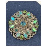 vintage German-made brooch features a gold-tone