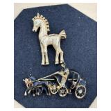 The standing horse brooch is styled as a toy with