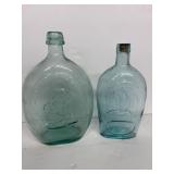 Vintage embossed aqua blue bottles