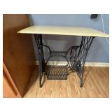 Cast iron Singer base with top.  Treadle Sewing