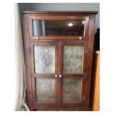 Rustic pie safe cabinet with punched tin panels