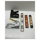 Two heavy duty staplers and three levels