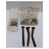 Antique railroad spikes with drill bits and
