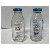 Two, 1 quart, Homestead Creamery milk jars.  One