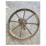 antique, rusty cast iron spoked wheel