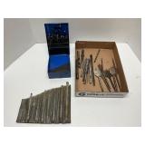 Assortment of used drill bits with case