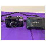 Vintage Minolta Hi-Matic AF2 35mm film camera.