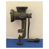 Vintage cast iron hand, crank food and meat